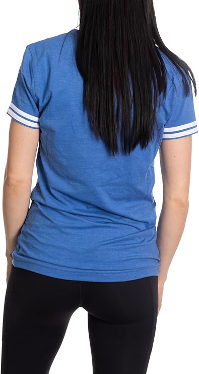 Woman wearing blue short sleeve t-shirt with white striped sleeves, back view