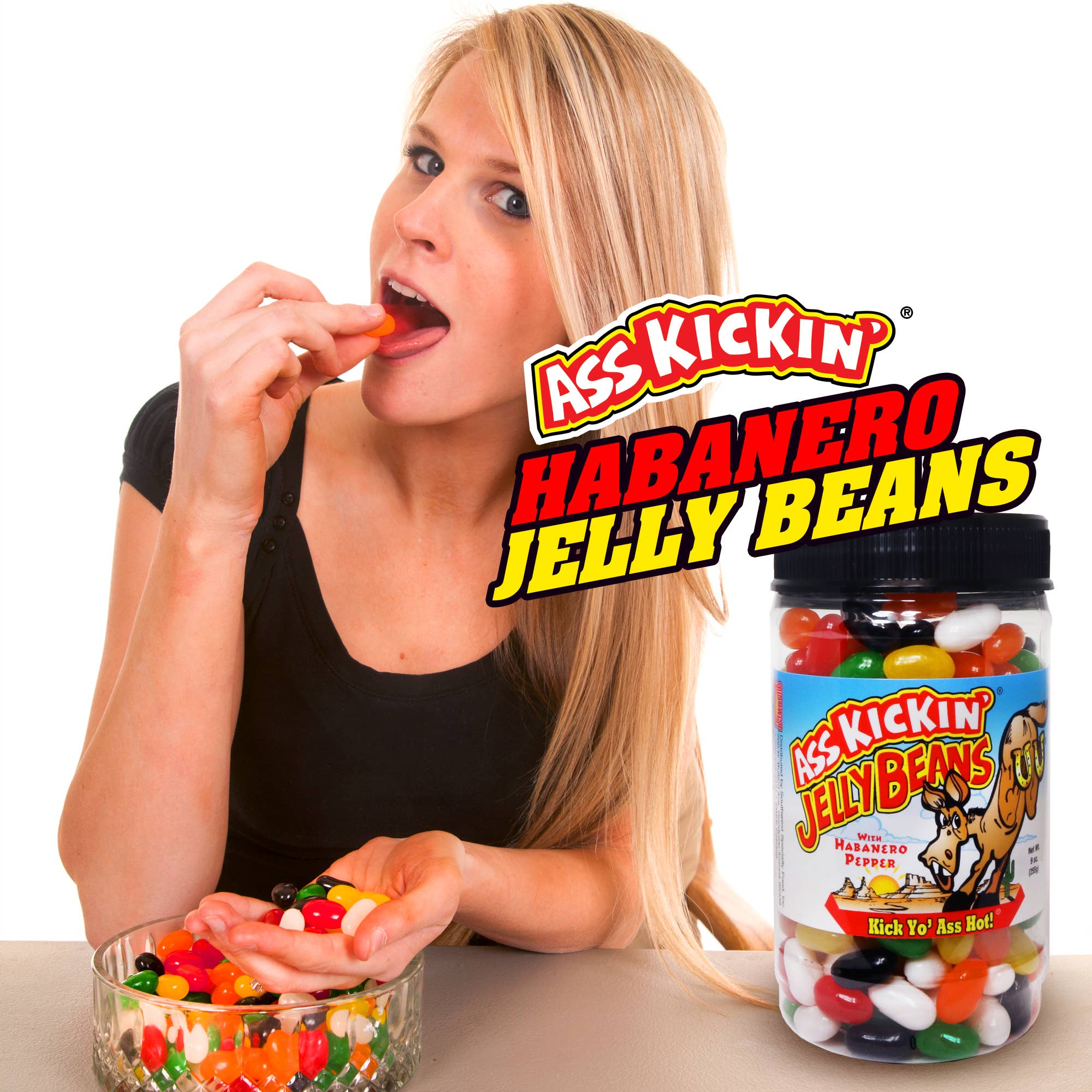 Woman eating spicy habanero jelly beans, jar of hot assorted jelly beans on table
