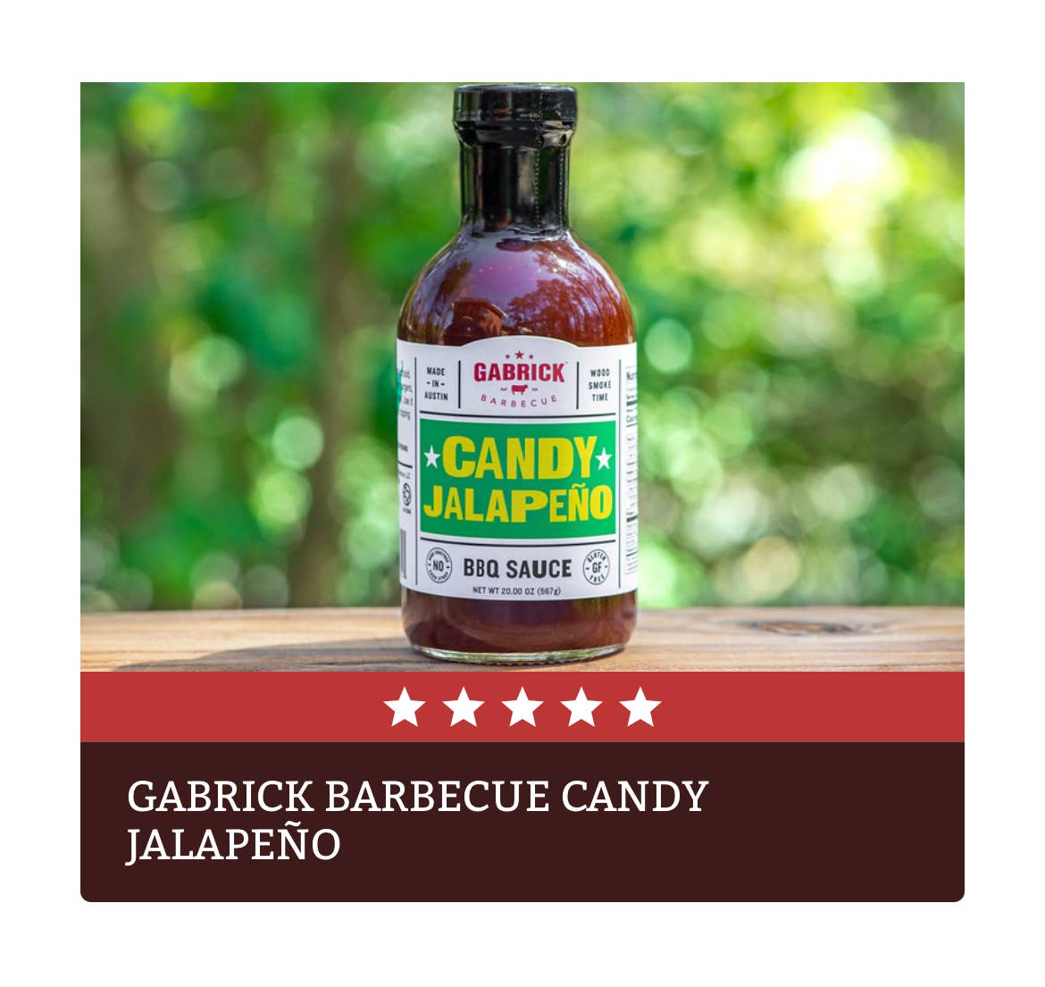 Gabrick barbecue candy jalapeño BBQ sauce bottle on wooden table outdoors