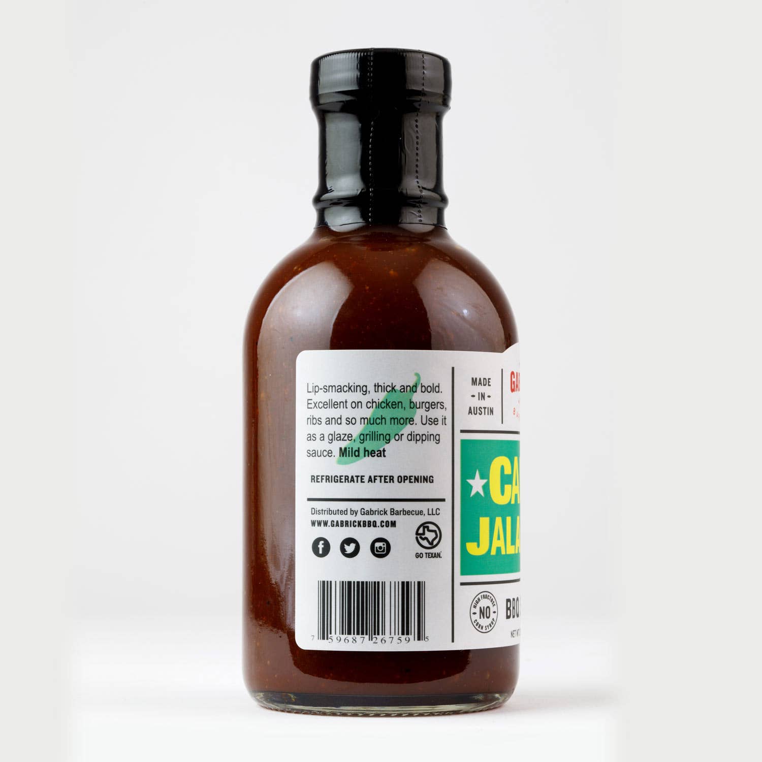 Barbecue sauce glass bottle with nutrition label, mild heat, ideal for grilling or dipping.