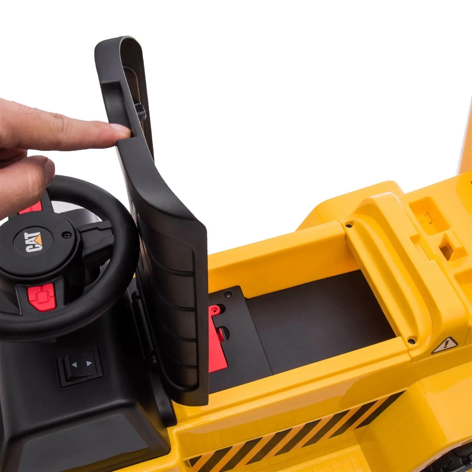 Yellow CAT dump truck ride-on toy seat and steering wheel close-up, safety feature shown