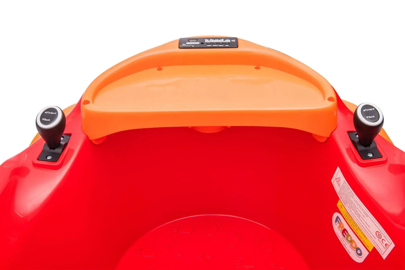 Close-up of red and orange bumper car interior with black joysticks and control panel.