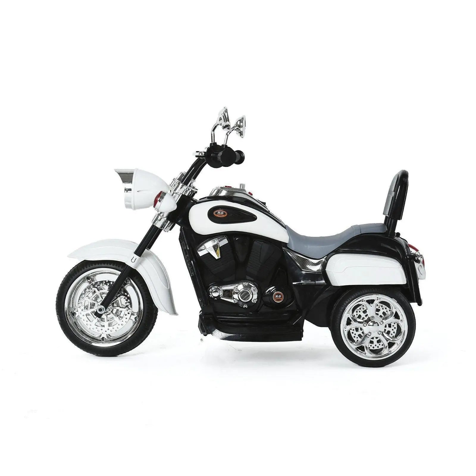 White and black chopper-style kids ride-on trike with chrome accents, side view