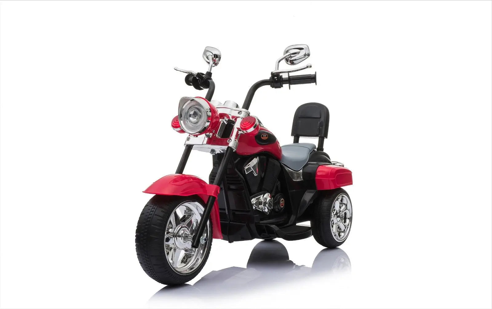 Red and black chopper-style kids ride-on trike with chrome accents, isolated on white