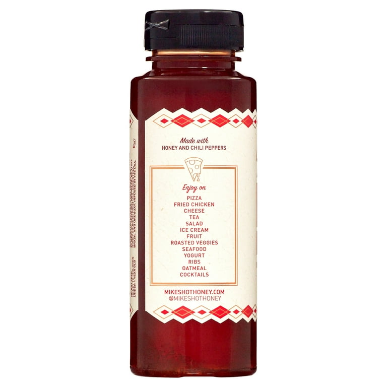 Bottle of honey and chili peppers sauce with suggested food pairings listed on label