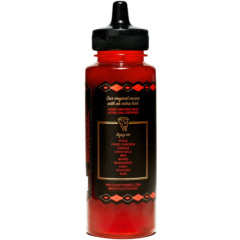 Spicy honey sauce bottle with chili pepper infusion and usage suggestions on black label
