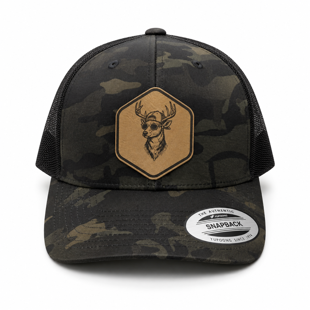 Leapfrog Backcountry Buck Trucker Hat featuring a custom leatherette deer patch, structured six-panel design, mesh back, and snapback closure.