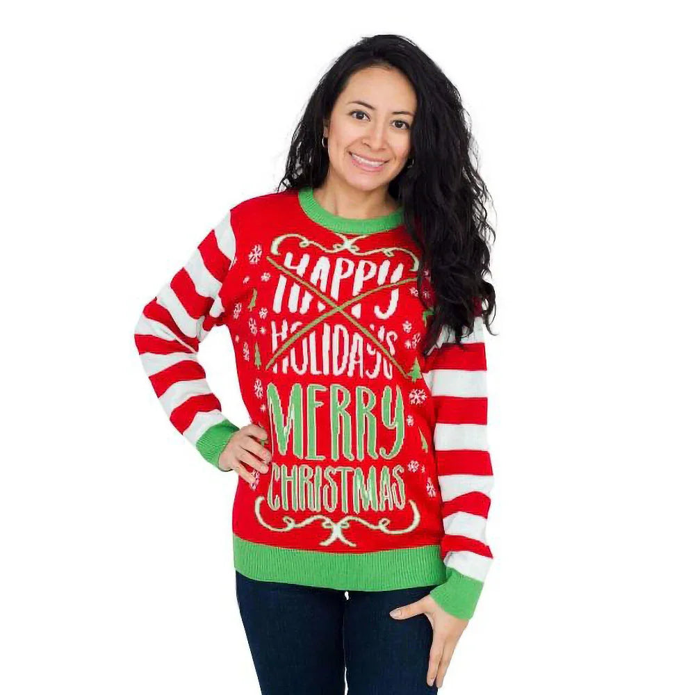 Smiling woman in a red Christmas sweater with 'Happy Holidays' crossed out and 'Merry Christmas' text, white and red striped sleeves, green cuffs.