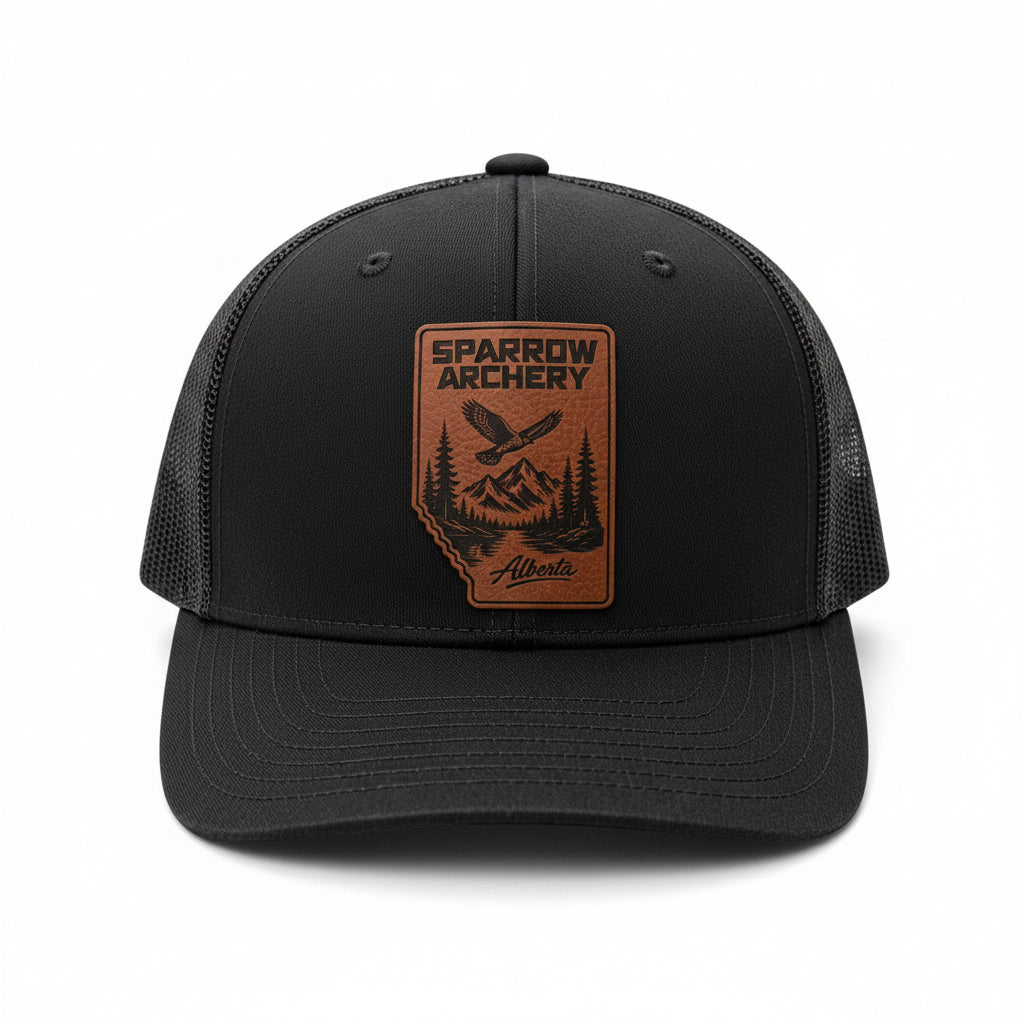 Sparrow Archery Alberta Summit Trucker Hat with custom Alberta-shaped leather patch and mesh back design.