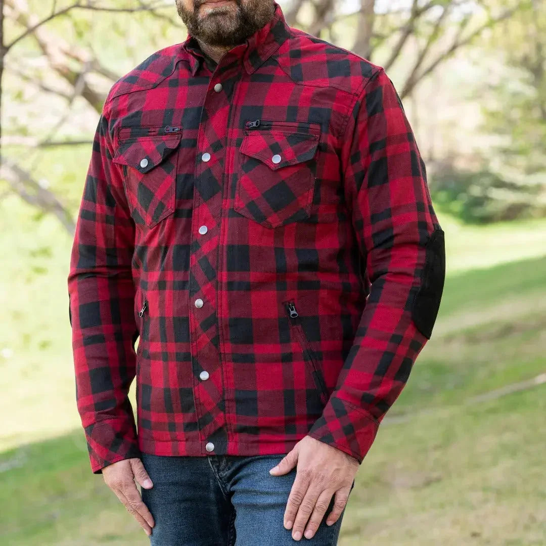 Man wearing red and black plaid armored flannel biker shirt with elbow protection outdoors