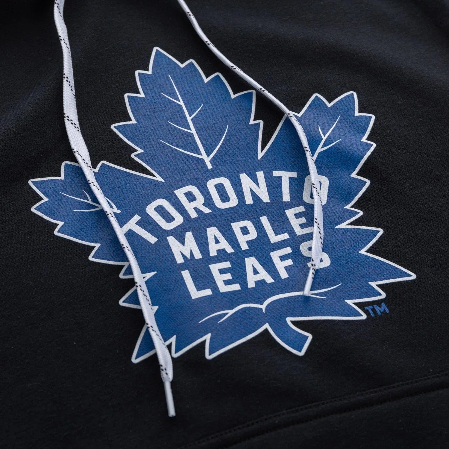 Toronto Maple Leafs logo on black varsity hoodie with white drawstrings