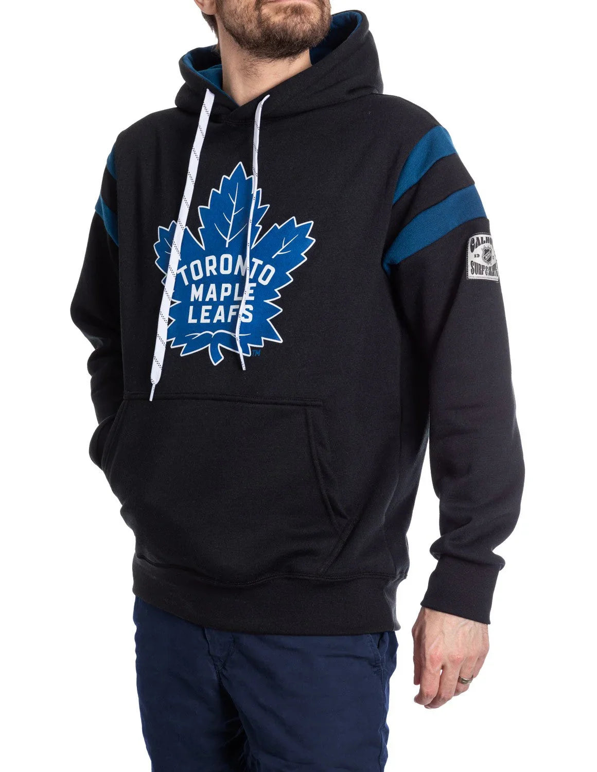 Man wearing Toronto Maple Leafs varsity hoodie with blue stripes and logo on front