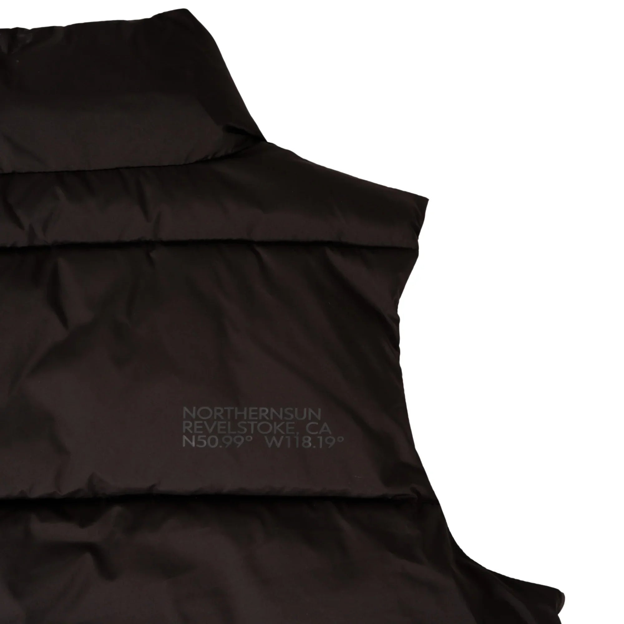 Women's black puffer vest with NorthernSun Revelstoke CA logo detail