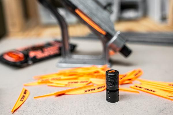 BITZKNOB black knob with textured grip, orange fletching tools, and arrow saw equipment