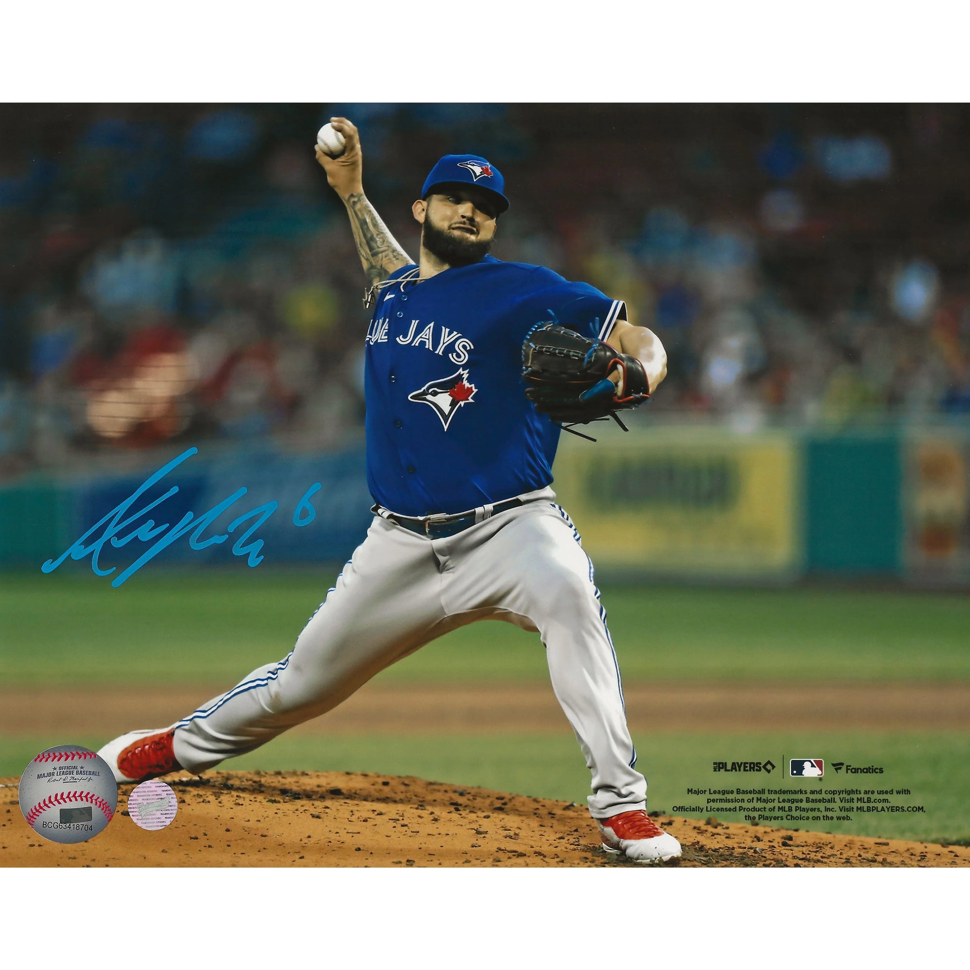 Toronto Blue Jays pitcher in blue jersey mid-throw on baseball mound, autographed photo