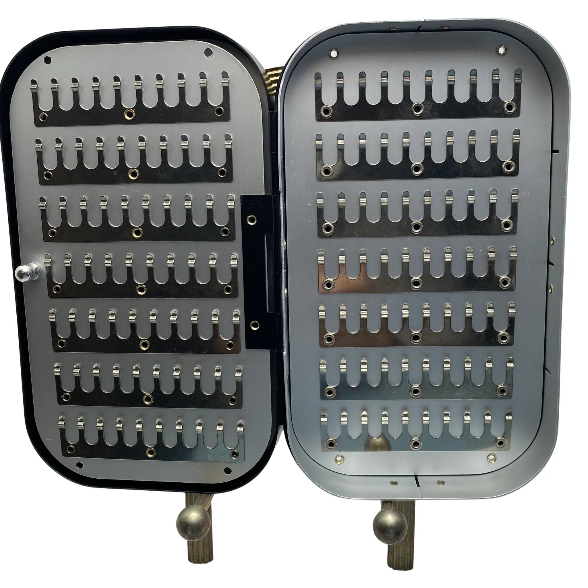 Open aluminum fly box with slotted metal rows for fly fishing lure storage