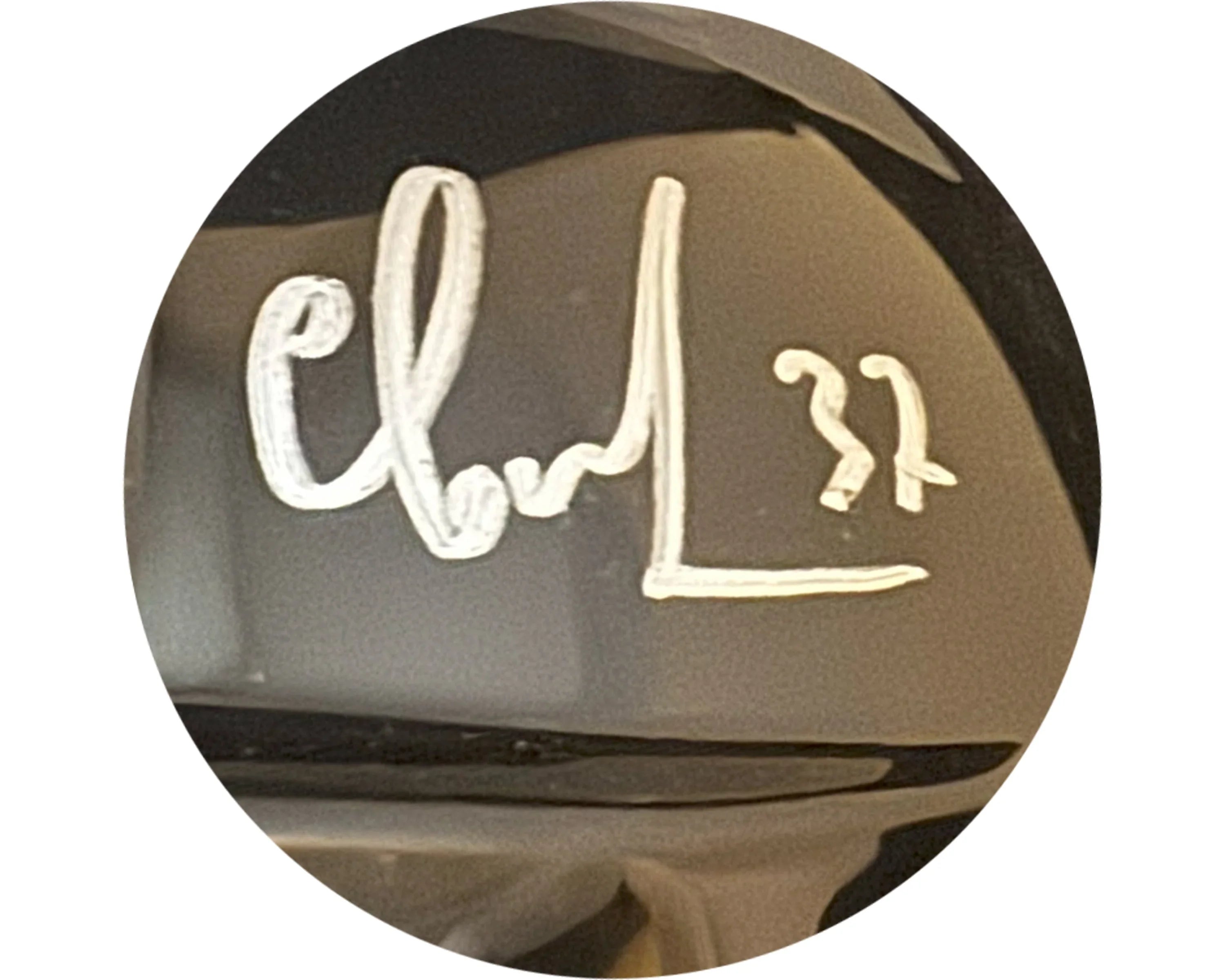 Silver marker autograph with number 22 on glossy black surface