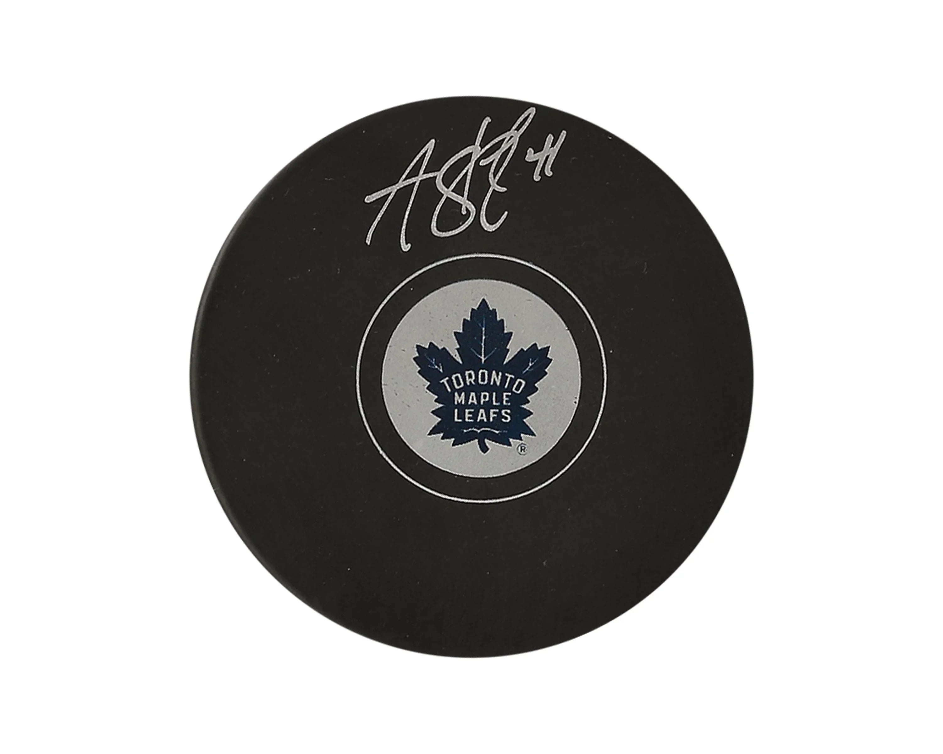 Toronto Maple Leafs signed hockey puck with blue maple leaf logo on white background