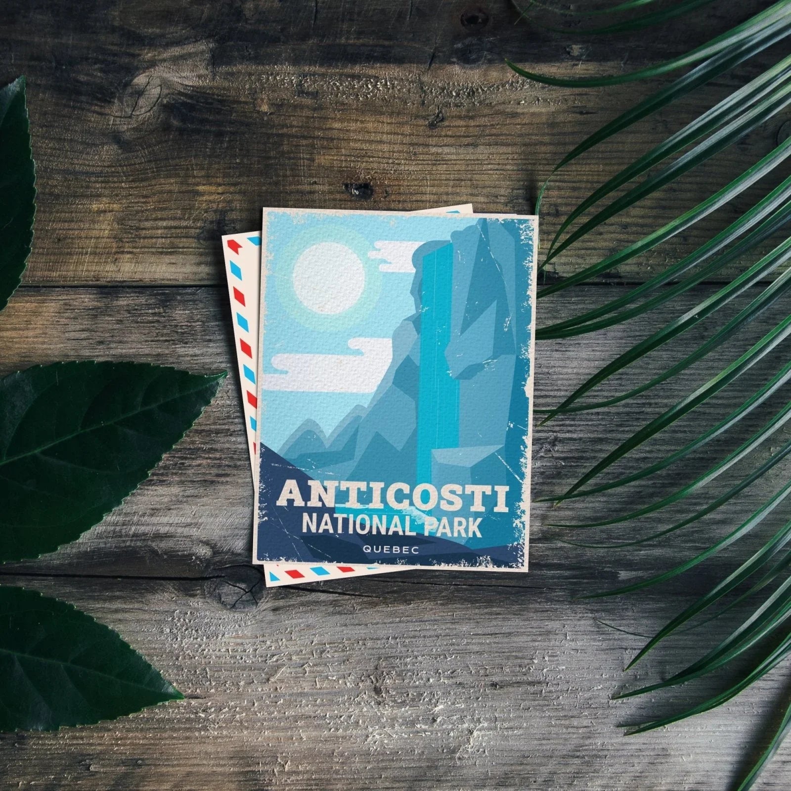 Anticosti National Park Quebec postcard on rustic wood with green leaves