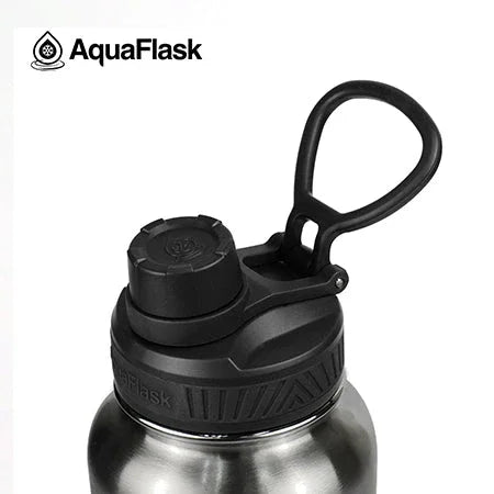 AquaFlask stainless steel water bottle with black screw cap and handle, close-up view.