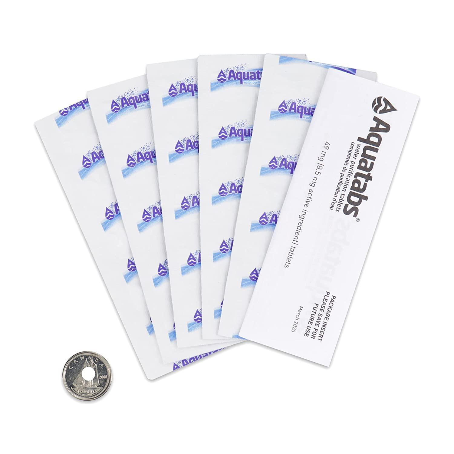 Aquatabs water purification tablets 50 pack with coin for size on white background
