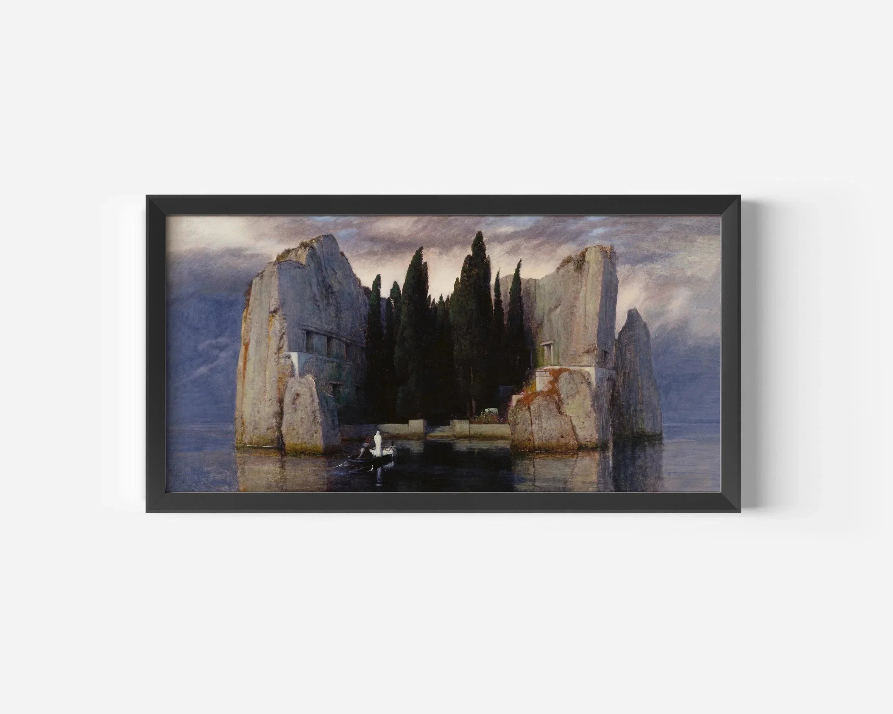 Framed print of eerie island with cliffs, cypress trees, boat on water, dramatic sky
