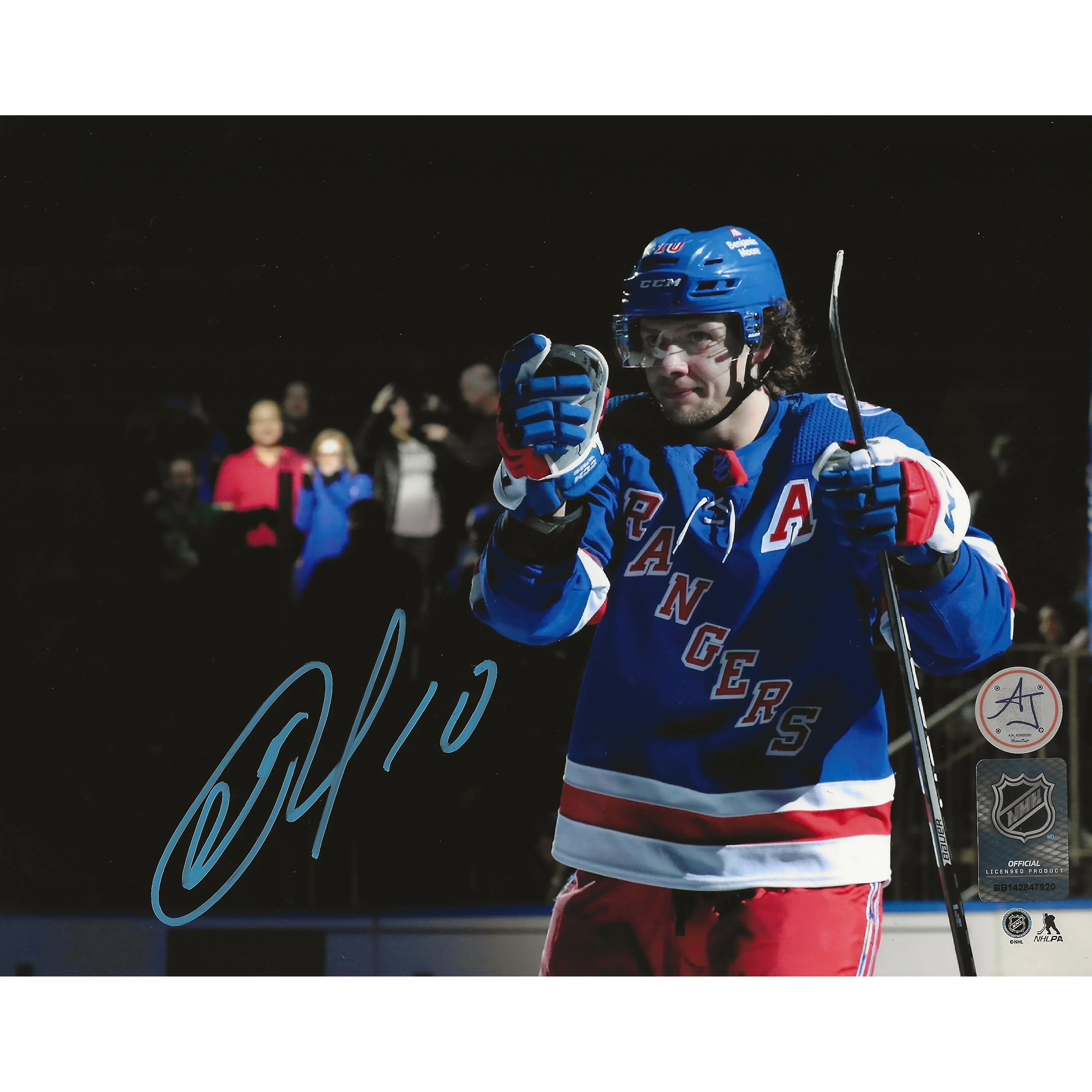 New York Rangers hockey player in blue jersey with stick and fans in background, autographed photo