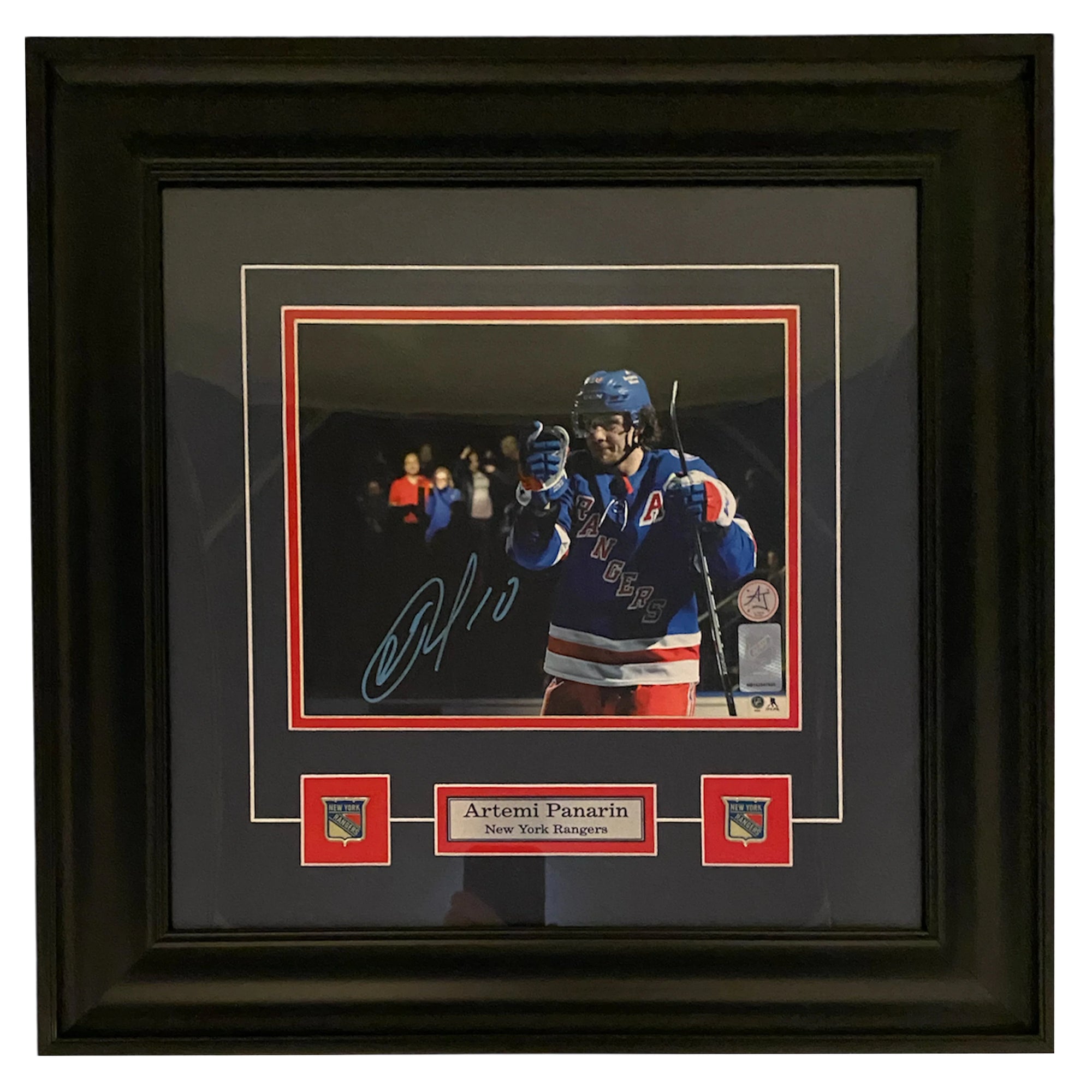 Framed signed photo of Artemi Panarin in New York Rangers hockey uniform display