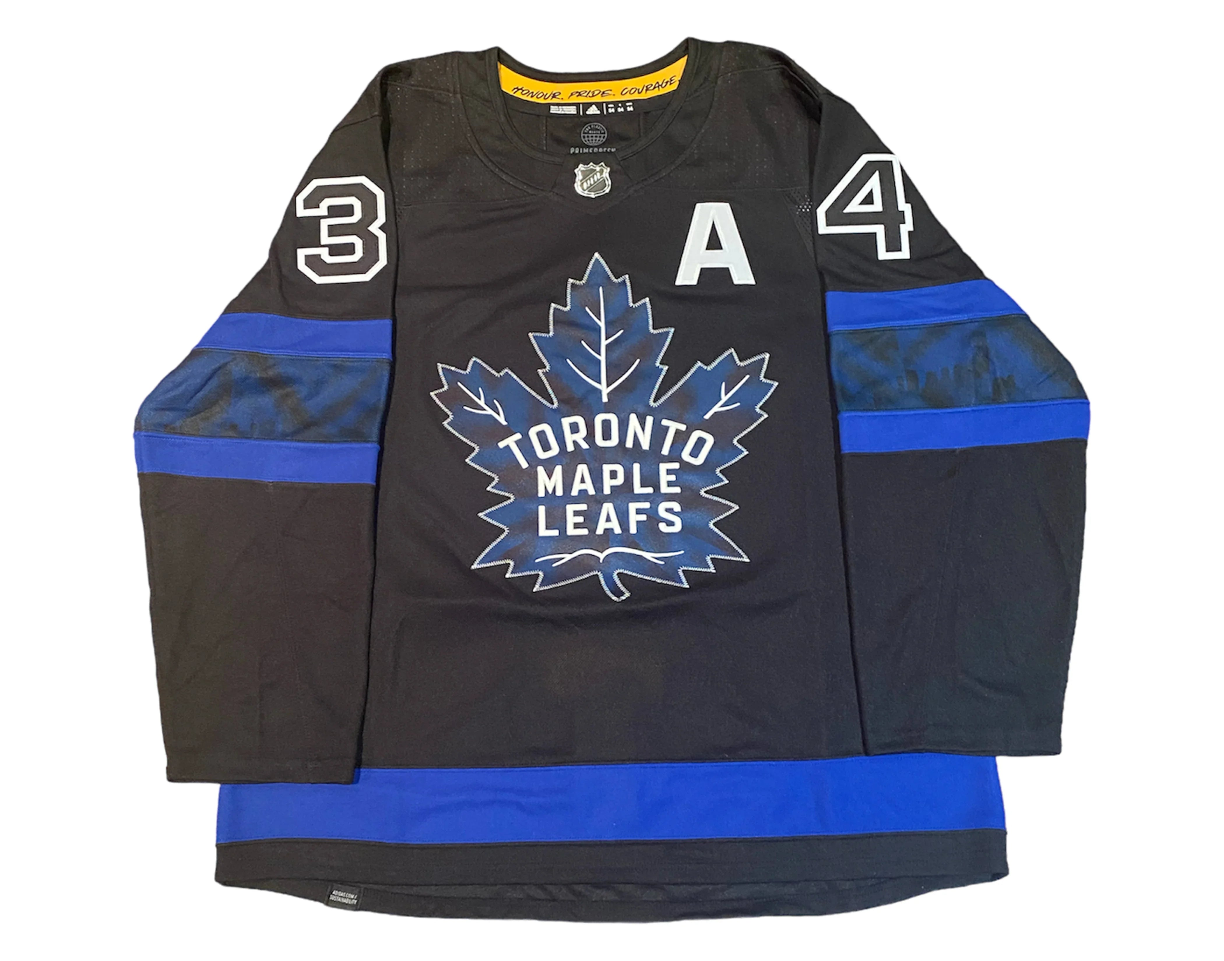 Toronto Maple Leafs black hockey jersey with blue stripes and large maple leaf logo