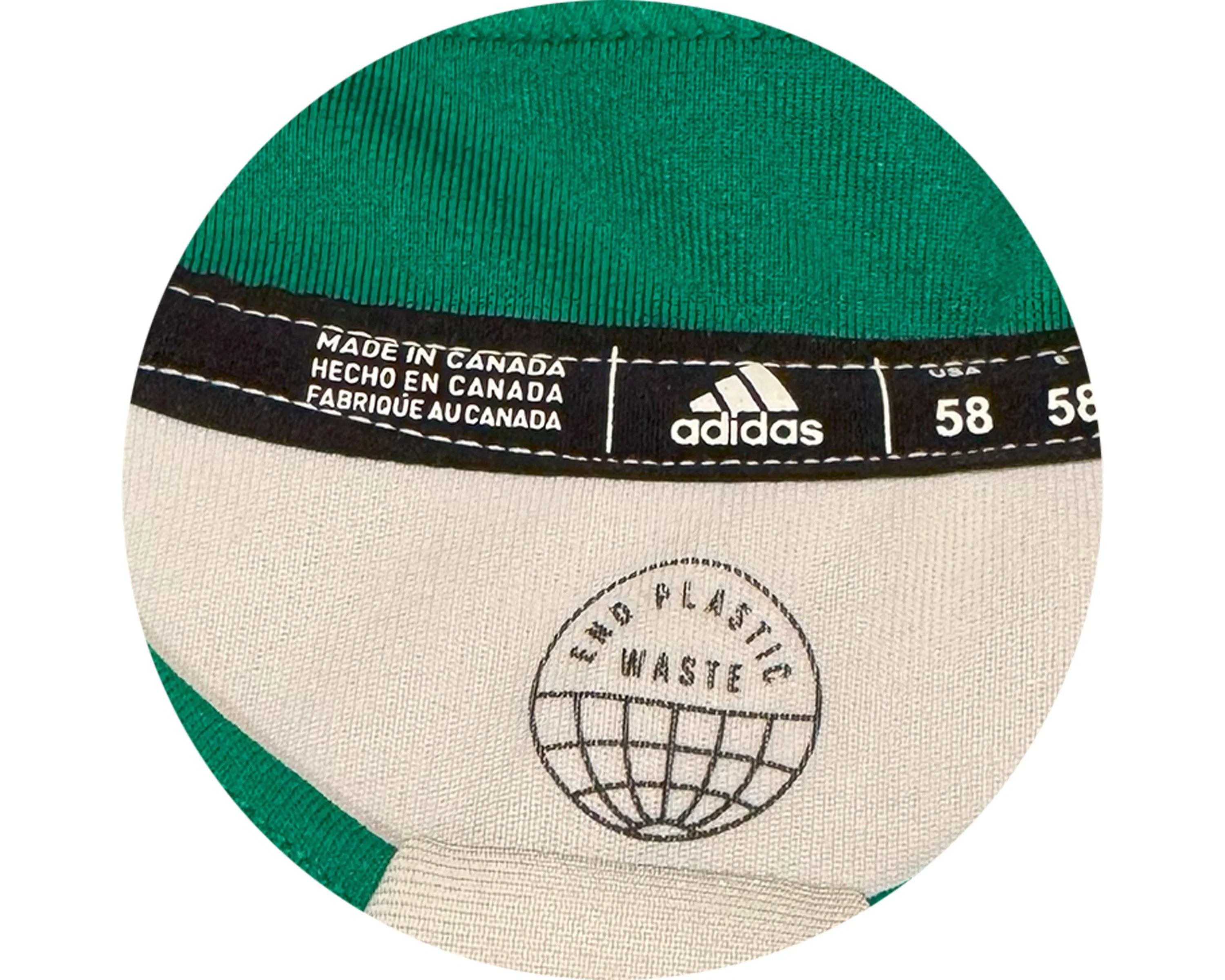 Adidas clothing tag with End Plastic Waste logo, made in Canada, size 58, green fabric