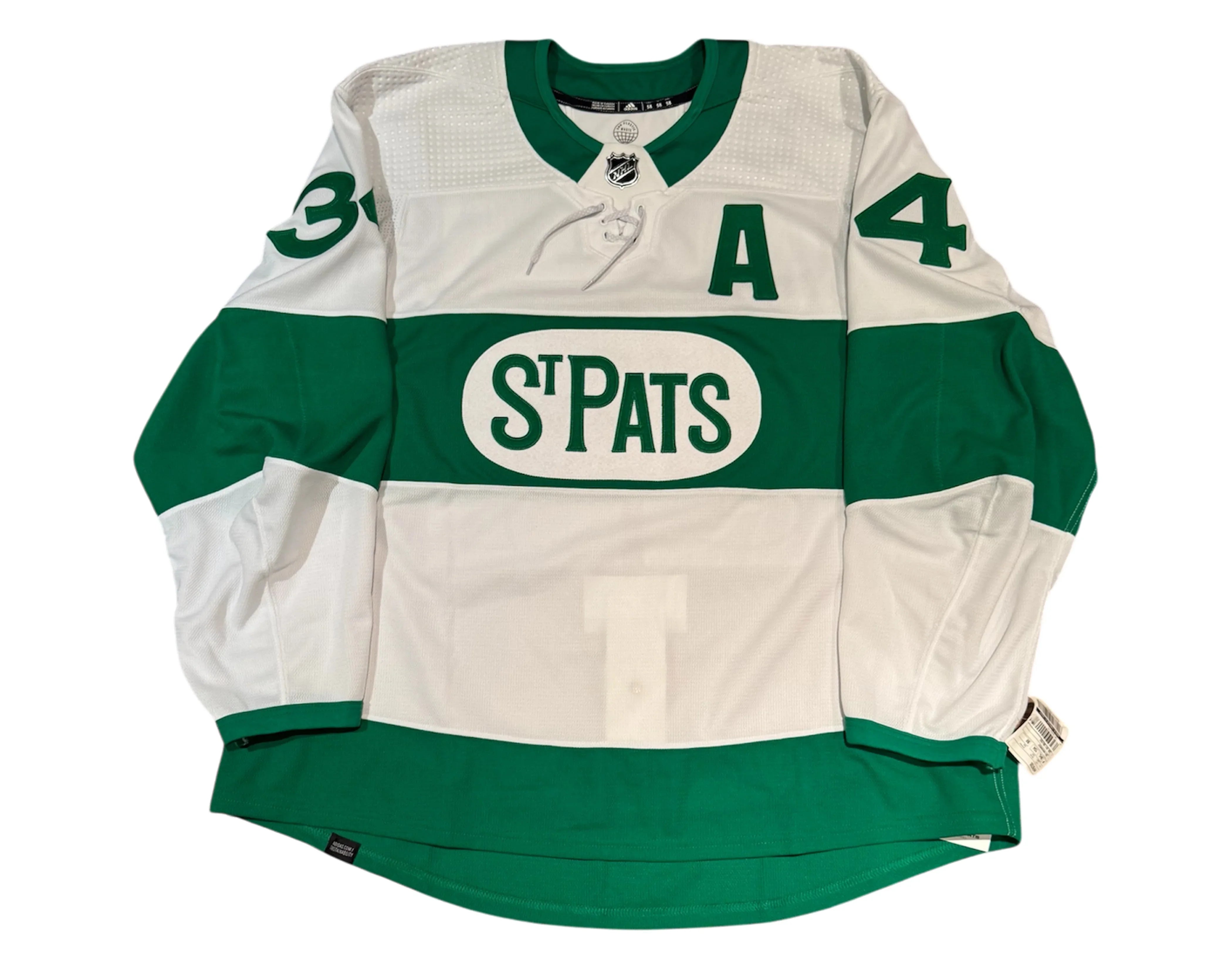 Toronto St. Pats green and white hockey jersey with number 34 and 'A' patch