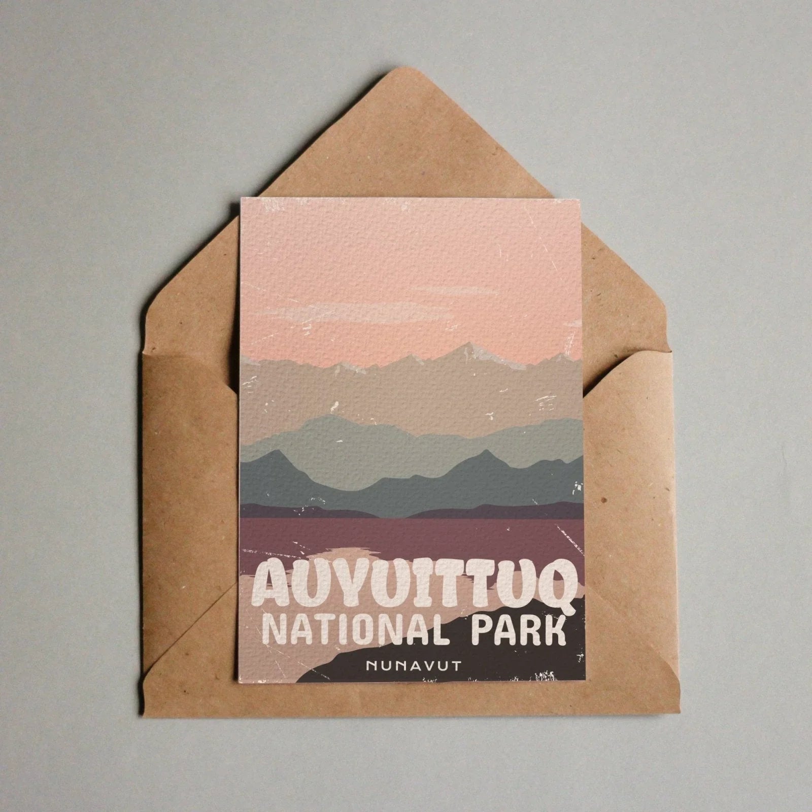 Auyuittuq National Park Nunavut postcard with stylized mountain landscape in envelope.