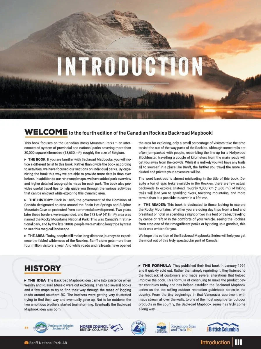 Canadian Rockies Backroad Mapbook introduction page with scenic mountain and lake background