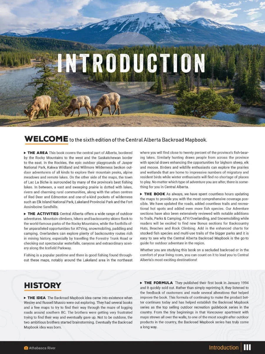 Central Alberta Backroad Mapbook cover featuring bighorn sheep by a river, forest, and mountains.