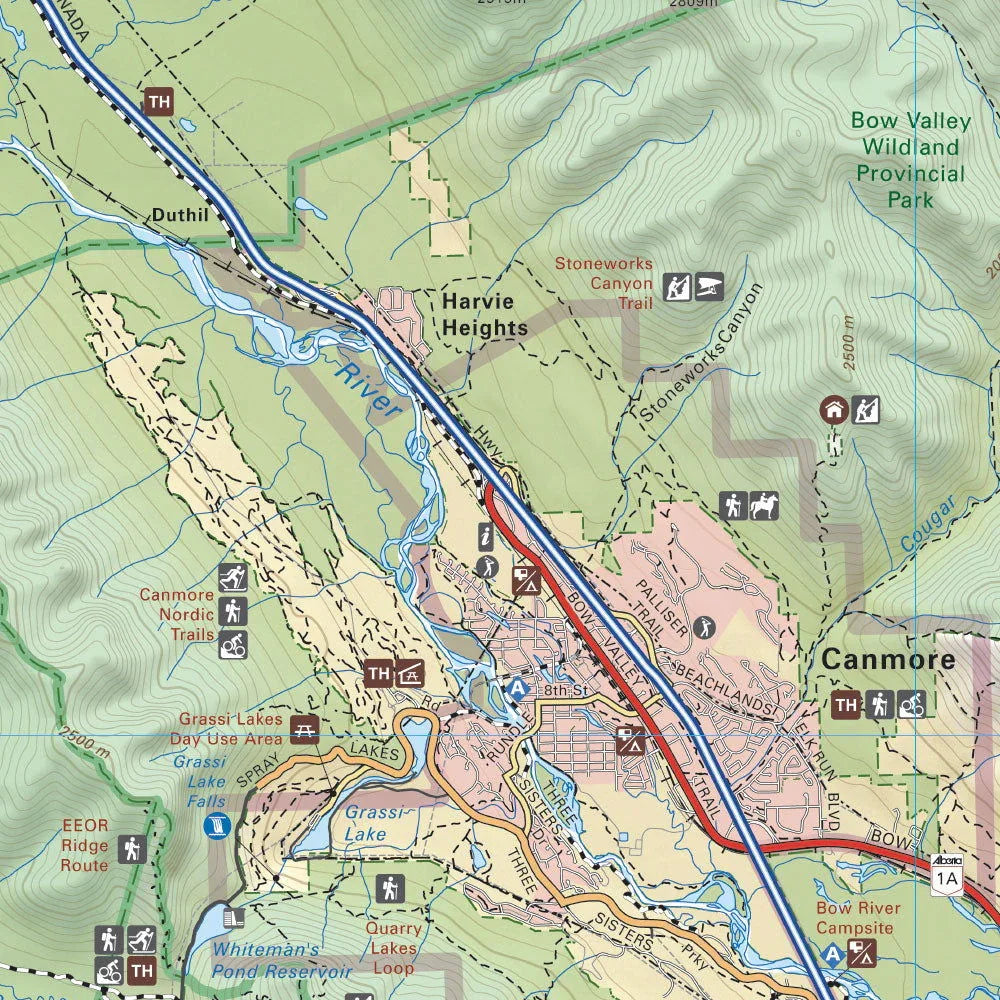 Map of Canmore, Alberta showing trails, Grassi Lakes, Bow Valley, and park areas in Banff.