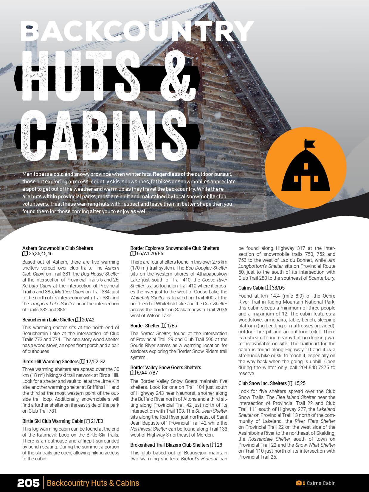 Snowy log cabin close-up with text 'Backcountry Huts & Cabins' for Manitoba mapbook guide