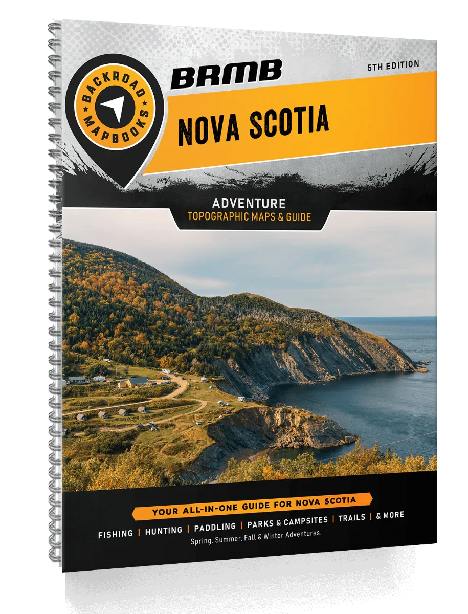 Nova Scotia Backroad Mapbook cover with scenic coastline, forested hills, and adventure guide text