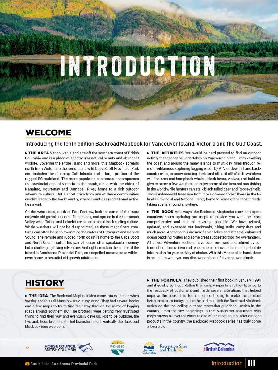 Vancouver Island Backroad Mapbook introduction page with mountain lake reflection and forest