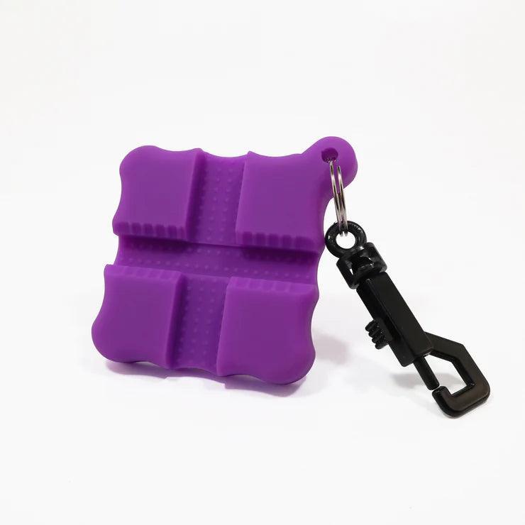 Purple archery flex arrow puller with black keychain clip on white background