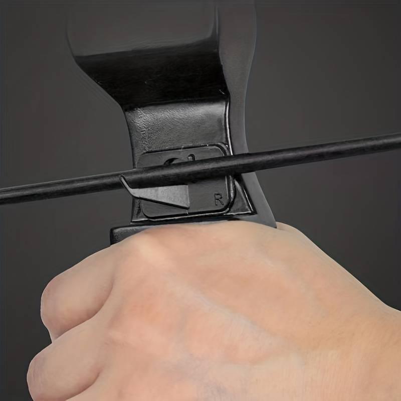 Close-up of hand holding recurve bow with stick-on arrow rest and nocked arrow