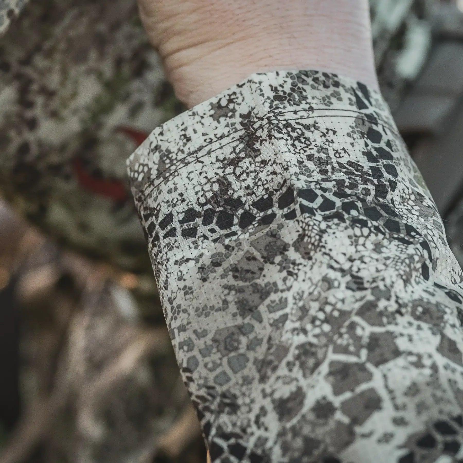 Close-up of Badlands Andaire camo sleeve, outdoor hunting shirt pattern in natural light