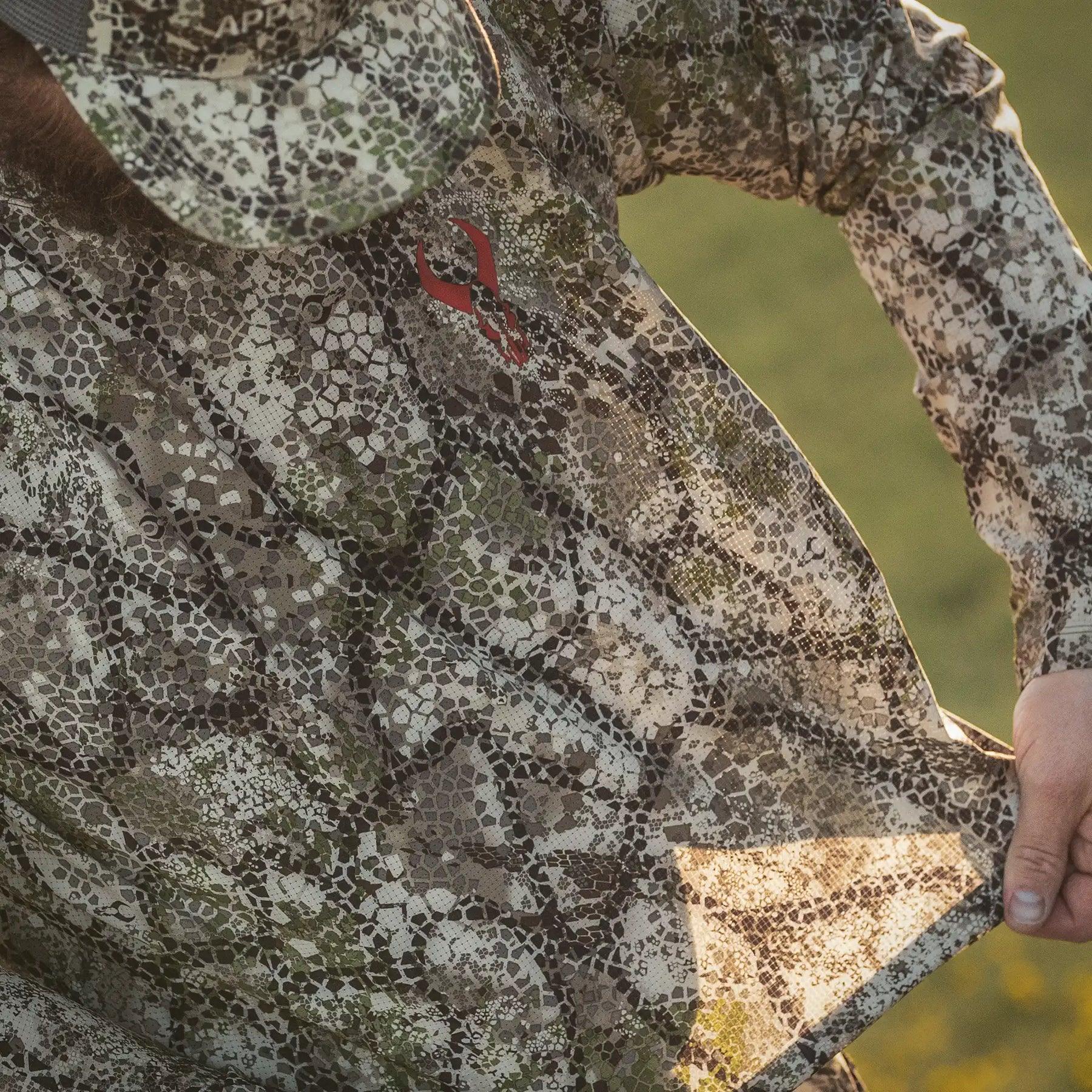Camouflage short sleeve shirt and cap with Badlands logo for outdoor sports