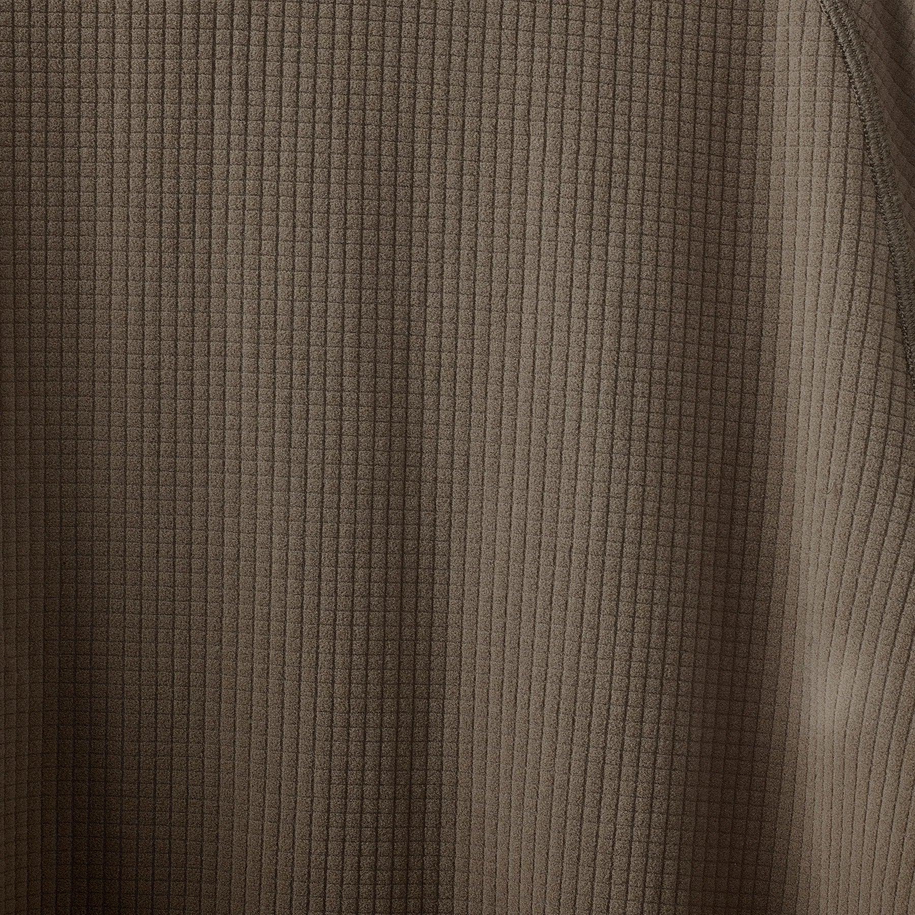 Close-up of ribbed knit brown fabric texture with vertical and horizontal lines
