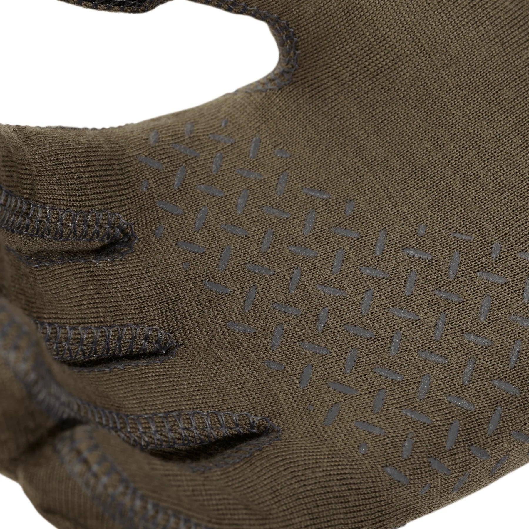 Close-up of brown textured work glove with black grip pattern