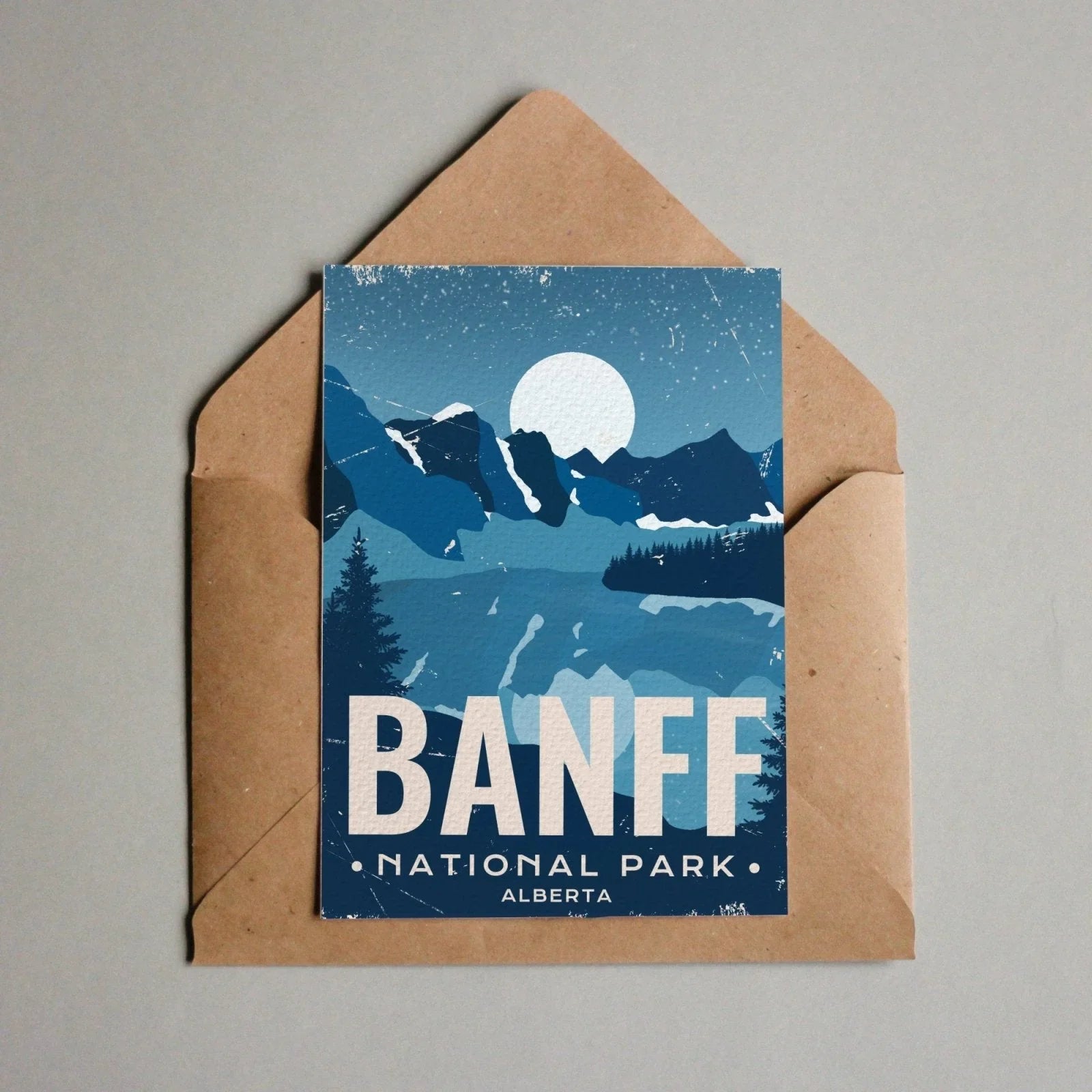 Banff National Park Alberta postcard with blue mountain landscape and full moon