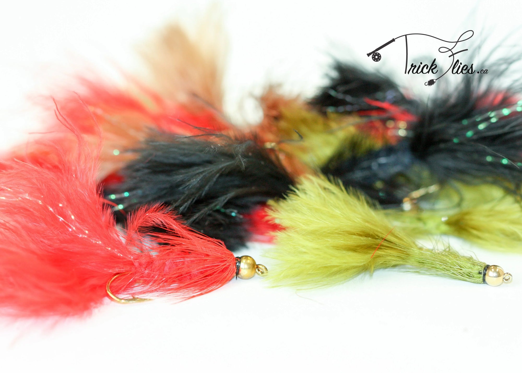 Colorful feathered woolly bugger fishing flies on white background with Trick Flies logo