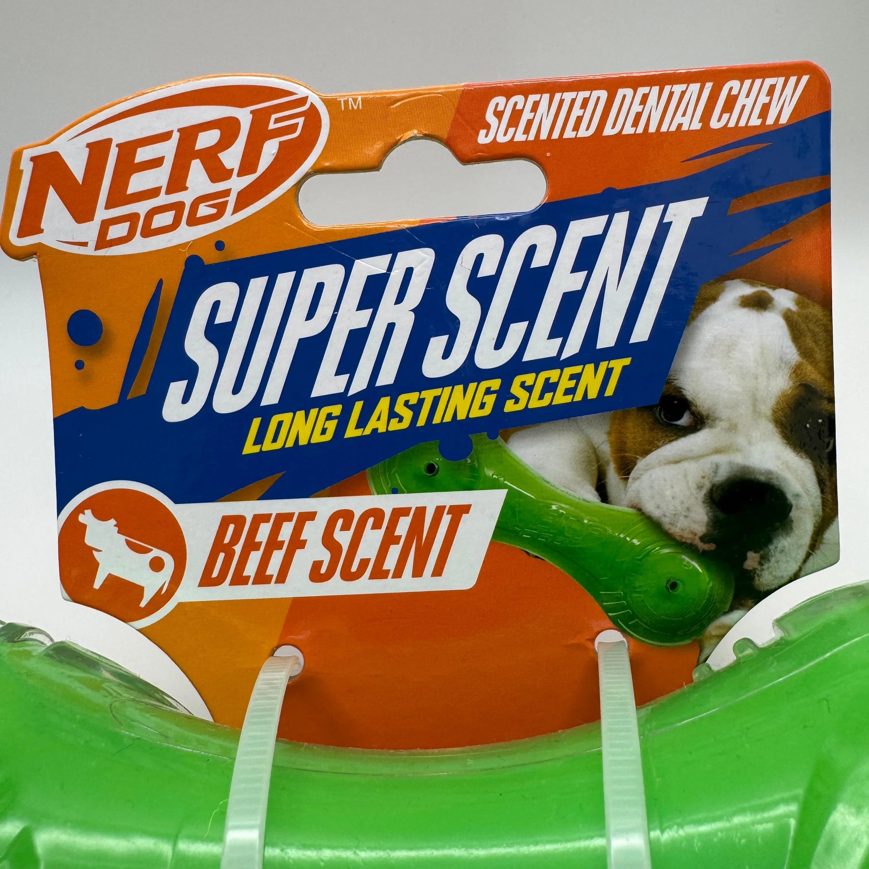 Nerf Dog Super Scent beef scented dental chew toy in green packaging with a bulldog image.