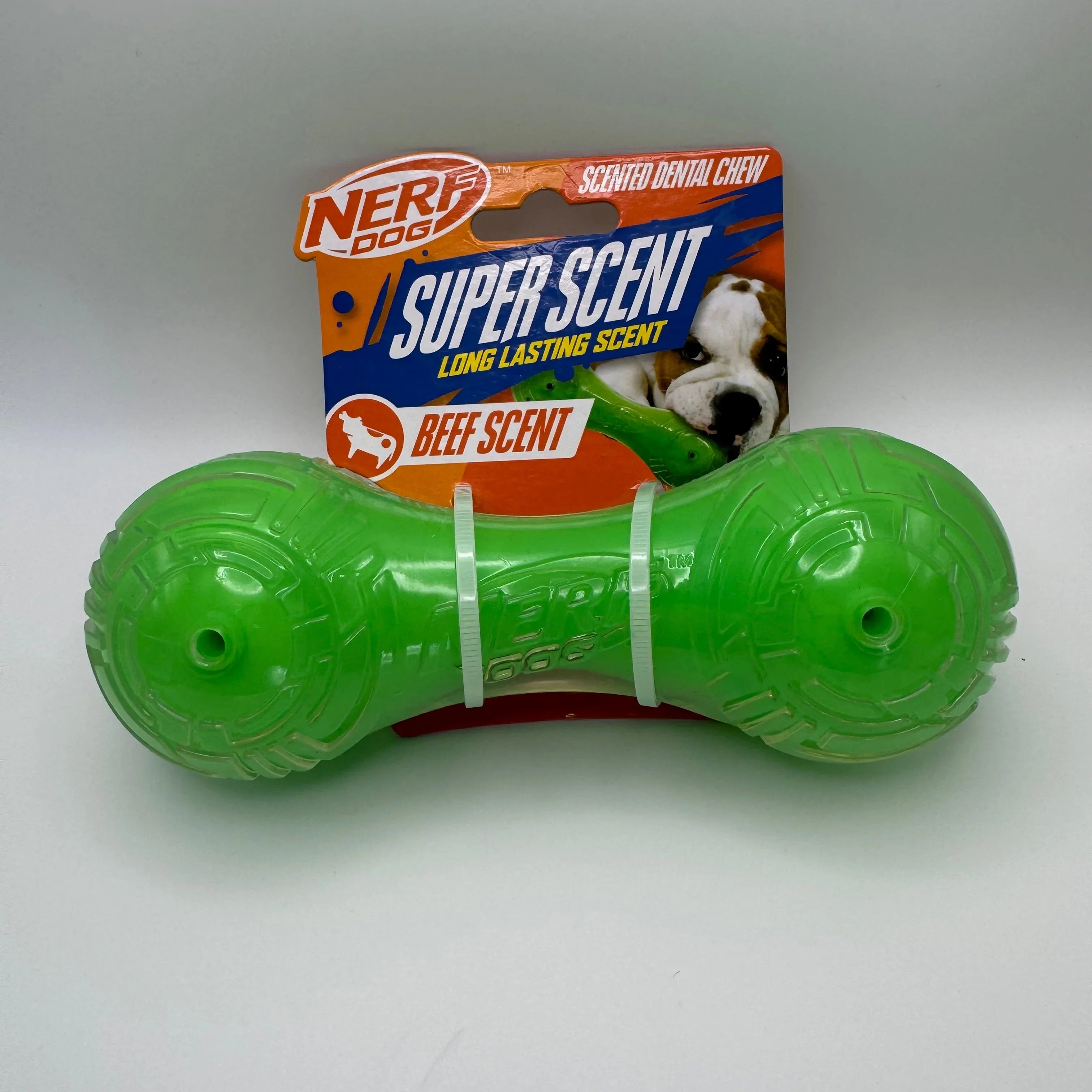 Nerf Dog green beef scent dental chew toy in packaging with dog image
