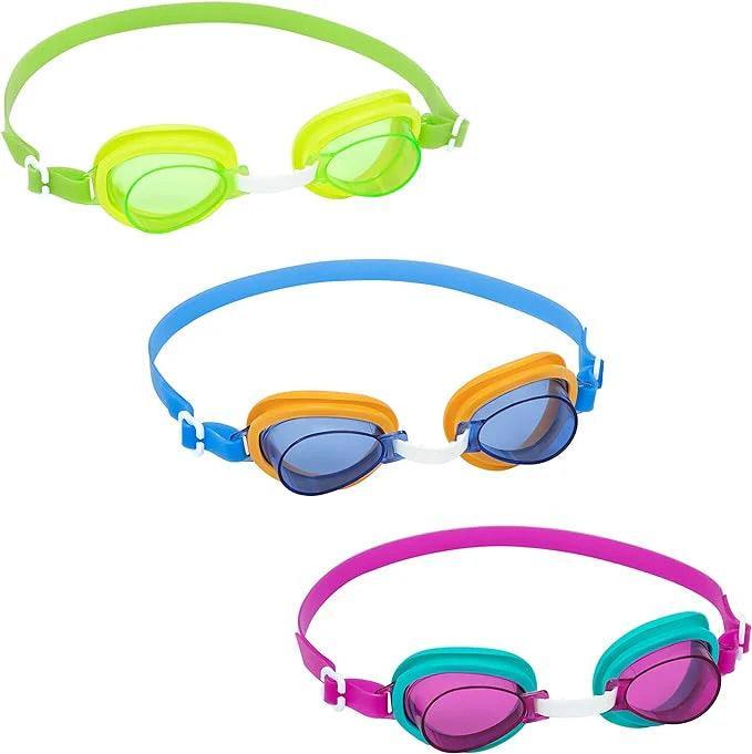 Set of three colorful kids swimming goggles in green, blue, and purple on white background