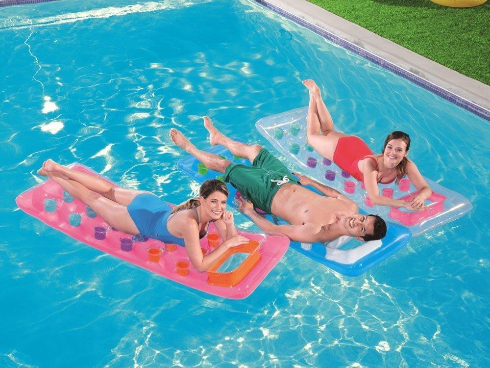 People relaxing on Bestway inflatable air mattresses in a swimming pool on a sunny day